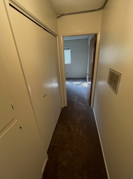 Hallway to bedroom 2 where washer/dryer hookups are located - 3262 Montrose Ave
