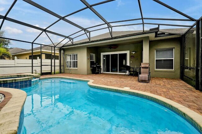 Building Photo - "Stunning 3BR Orlando Home with Private Screened Pool, Spa & Spacious Living Areas"