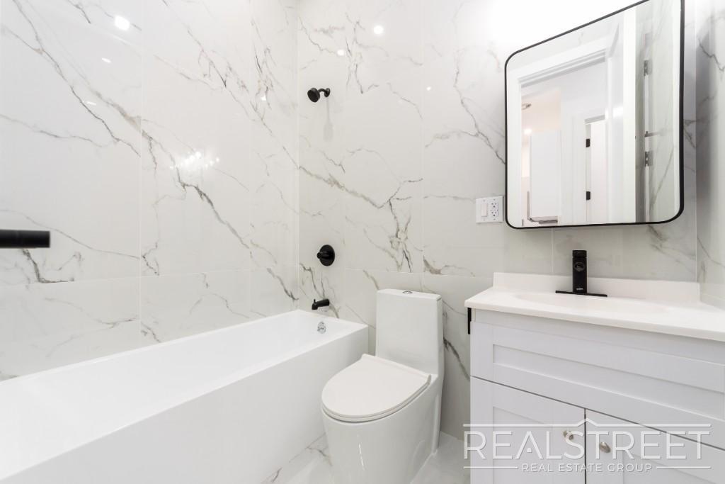 Building Photo - Brand New 4 Bed, 2 Bath with In-Unit Laundry, Private Balcony & Central Air