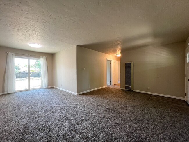 Building Photo - Freshly Renovated 3 Bedroom Home with Large Fenced Yard & Double Garage