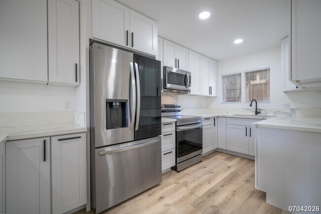 Building Photo - Rarely available ground floor townhome unit! 2 bdrm/2 bath/1 parking at Waiau Gardens Villa in Pe...