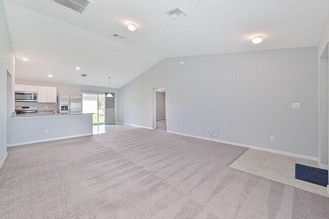 Building Photo - Spacious Three-Bedroom Home with Open Floor Plan, Large Yard