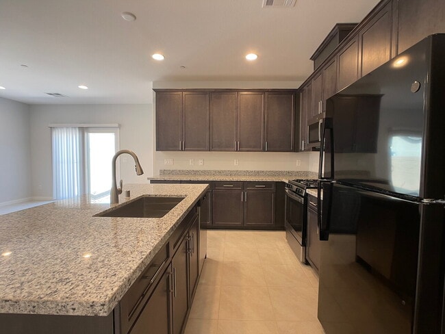 Building Photo - 4 BED 2 BATH 2 CAR GARAGE SINGLE STORY SINGLE FAMILY HOME w/ PAVED BACKYARD IN CADENCE COMMUNITY,...