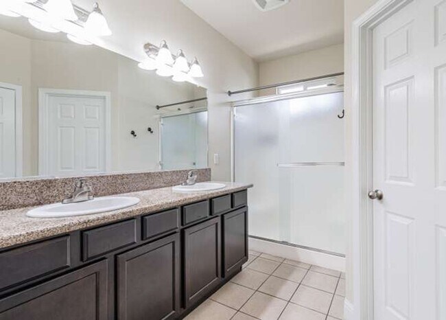 Building Photo - Four bedroom/2-bath home with 2-car garage