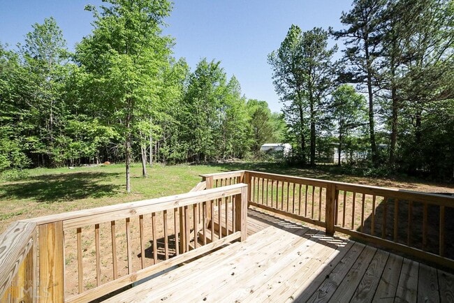 Building Photo - Spacious 4-Bedroom Home with Lawn Maintena...