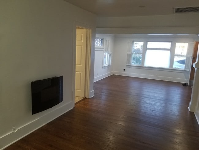 Living room with electric fireplace - 4436 Kingswell Ave