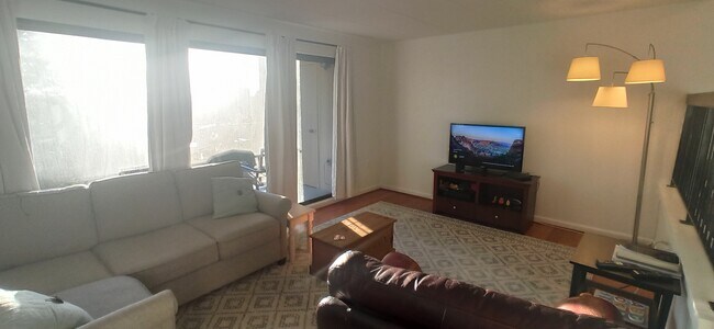 Living room with direct access to balcony - 100 Roberts Ln