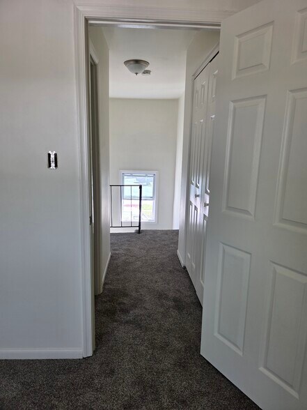 Upstairs hallway- linen closet on right - 1718 Judy Way