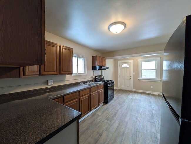 Building Photo - Large 4 Bedroom Home with Garage, Deck, & Fence!