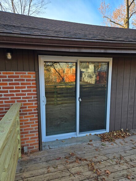 Sliding doors leading to private deck off of living area - 60 W Winter St