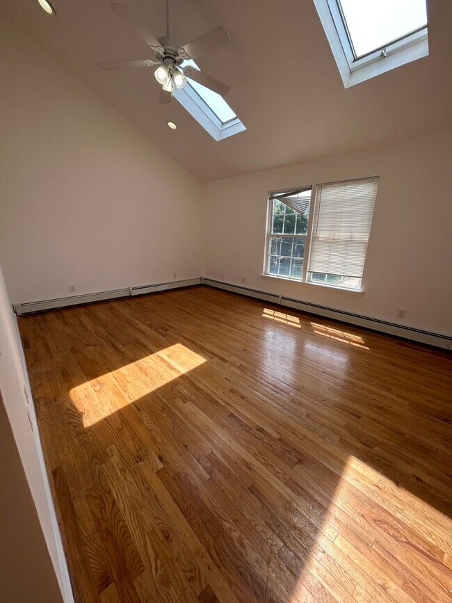 Building Photo - Discover Your Dream Home in Neptune: Spacious 4-Bedroom, 2.5-Bath with Private Backyard and Drive...