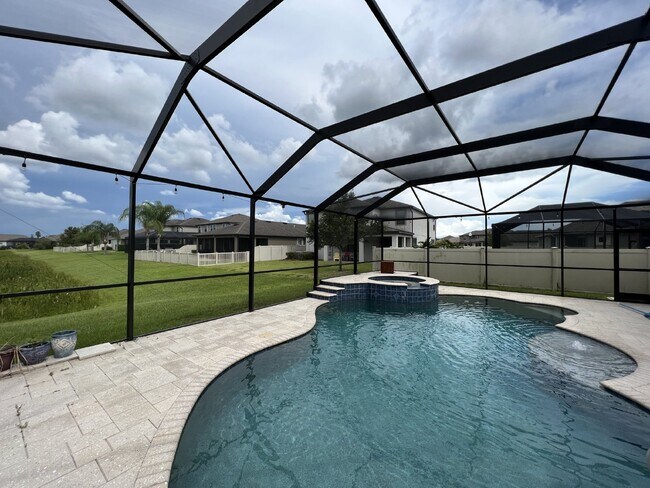 Building Photo - "Spacious 4-Bedroom Lutz Home with Elegant...