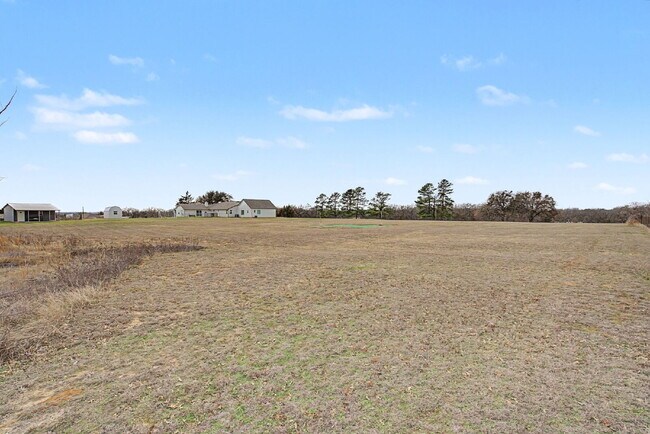 Building Photo - “Farmhouse Charm Meets Modern Luxury on a Serene 5-Acre Lot!”