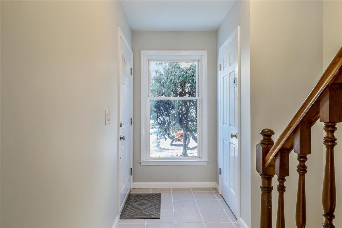 Foyer entrance with large window and closet - 20 Raymond Plz