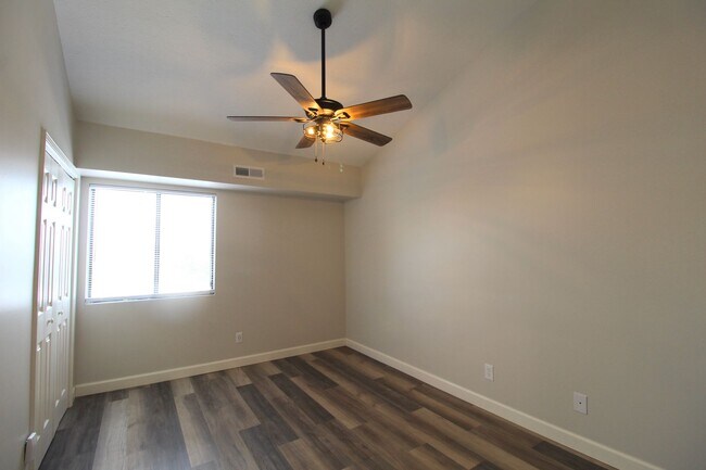 Building Photo - Fun and Stylish Living at Madison Manor! Top-Floor Condo with Vaulted Ceilings and Skylights