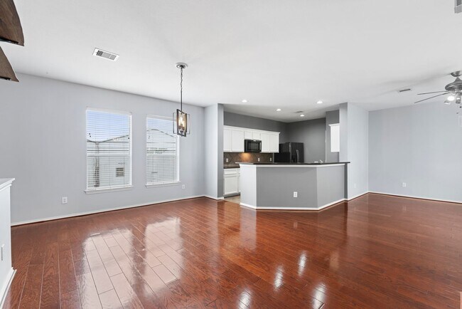 Building Photo - Come see this modern 3-story townhome in t...