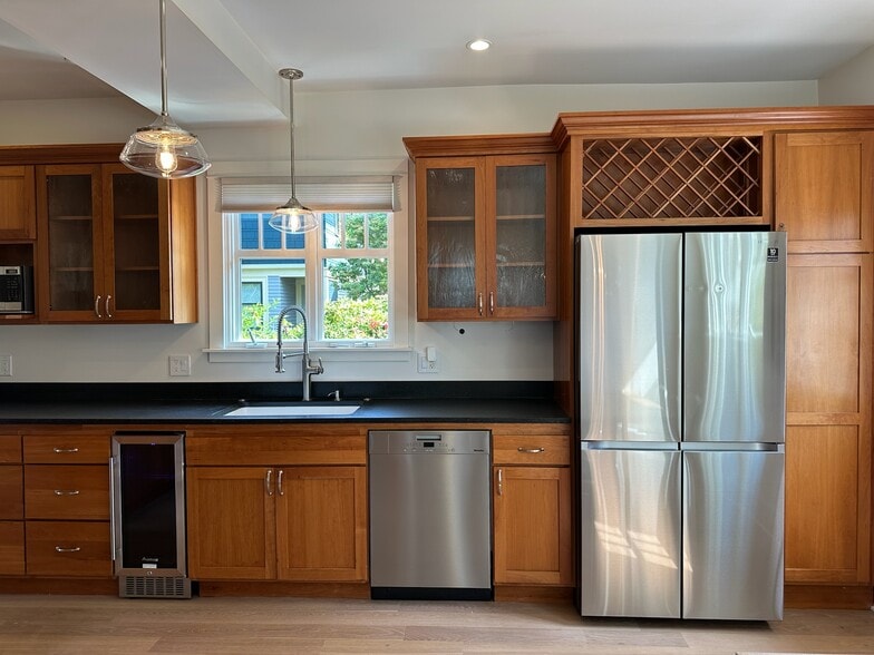 Chef's kitchen with Wolf gas range, new Miele DW, fridge w/ water/ice maker, beverage fridge - 211 W Boston St