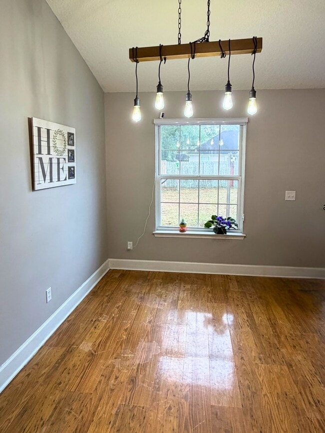 Building Photo - 4/2 with a LARGE fenced in yard!