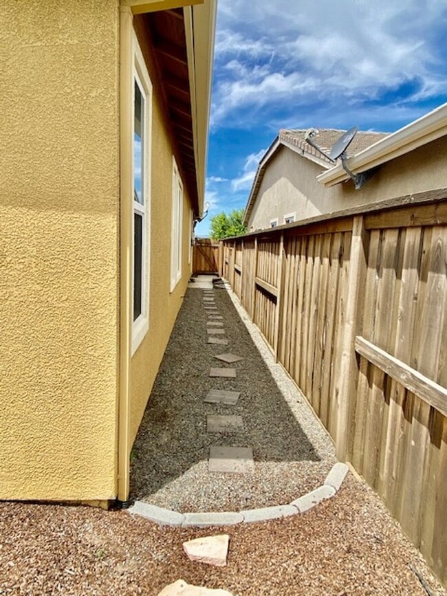 Building Photo - ALMOST NEW, UNIQUE 4 BEDROOM, 3 BATH, 2 CA...