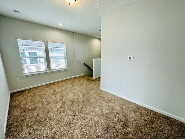 Building Photo - Spacious End Unit with Garage & Loft. Community features High End Amenities!