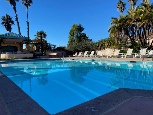 Building Photo - NEW PRICE! Spacious 3bdrm 2.5bath Condo w/2 car garage & private laundry hookups, community Pool ...