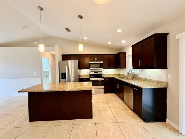 Building Photo - Move-In Ready 3BR Home in SW Cape Coral with Fenced Yar+Screened Lanai+Lawn Care Included+Pet Fri...