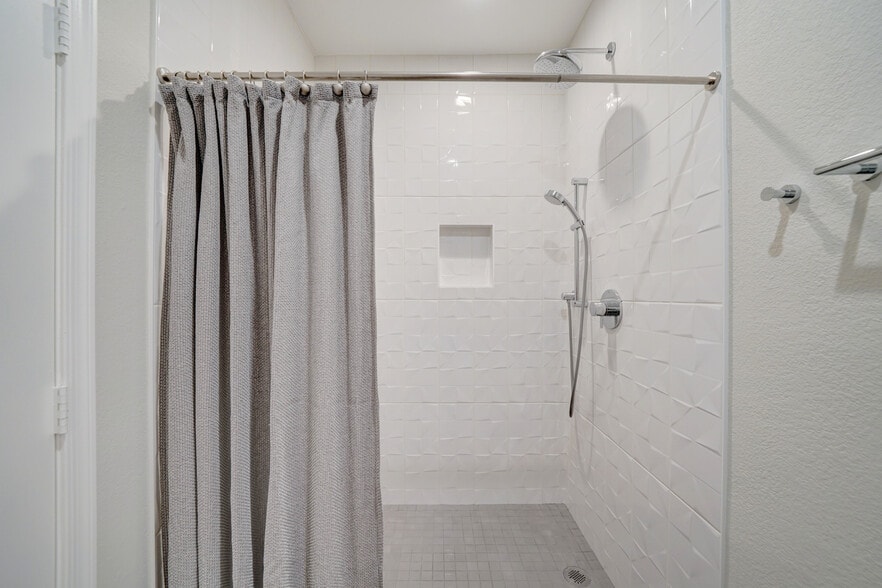 Large shower with Grohe fixtures and modern porcelain tile - 435 W Rio Salado Pky