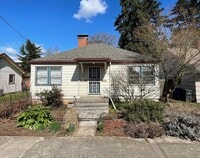 Building Photo - St. Johns 1940s 2Bd 1Ba home with updated Kitchen and a Basement! Features a Stained glass Outdoo...