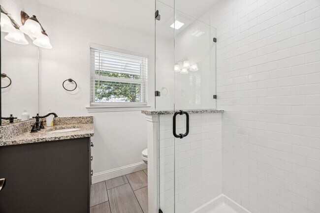 Building Photo - Stylish Renovation + Solar Savings in Prime Location