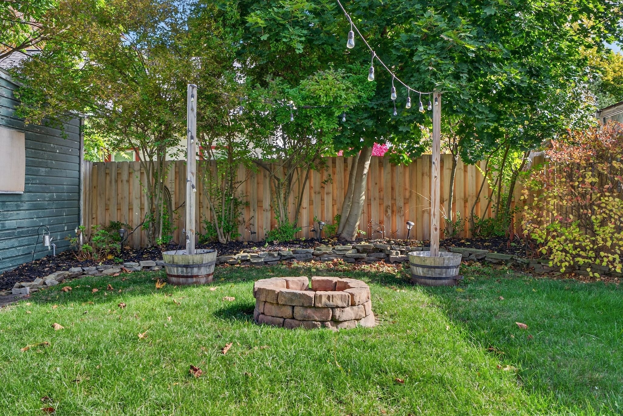 Backyard with Fenced in Yard and String Lights - 4429 S Hills Dr