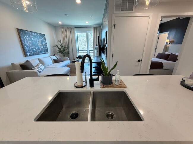 Building Photo - Top-Floor Corner Condo with Downtown Views — Stylish, Pristine, and Steps From Everything