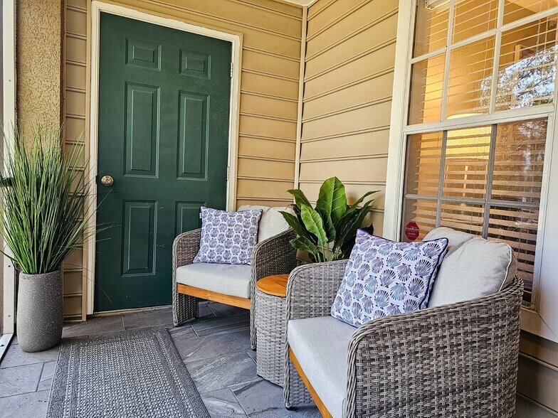 The private porch area overlooks the lake and creates a peaceful atmosphere - 8923 Manor Loop