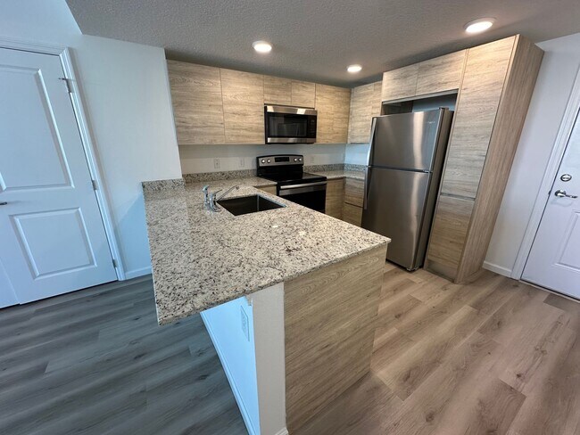 Building Photo - Spacious 2-Bedroom + Den Apartment in Prim...