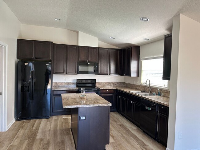 Building Photo - Spacious 4-Bedroom Home with Fantastic Ame...