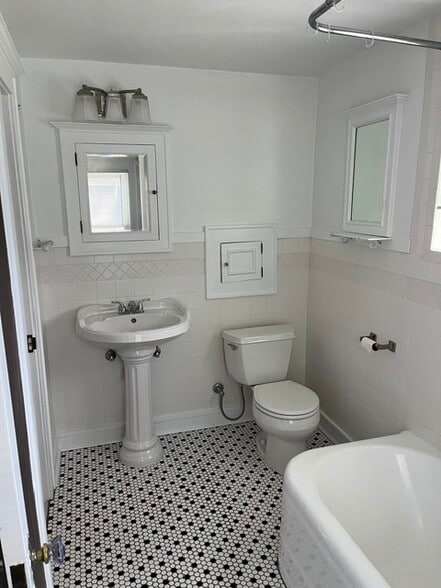 New hex floor tile, new fixtures, shower and tub. On second floor of home. One bathrm - 221 Houston Pl
