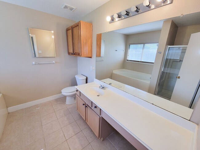 Building Photo - 3 bedroom one story home on large corner lot. Home has hard flooring throughout living areas and ...