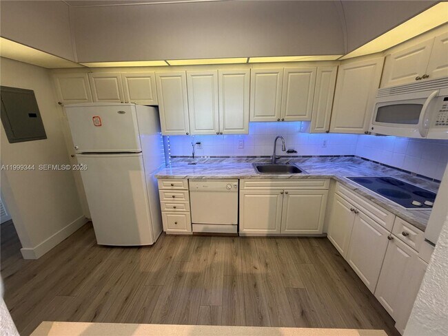 Building Photo - 19380 Collins Ave