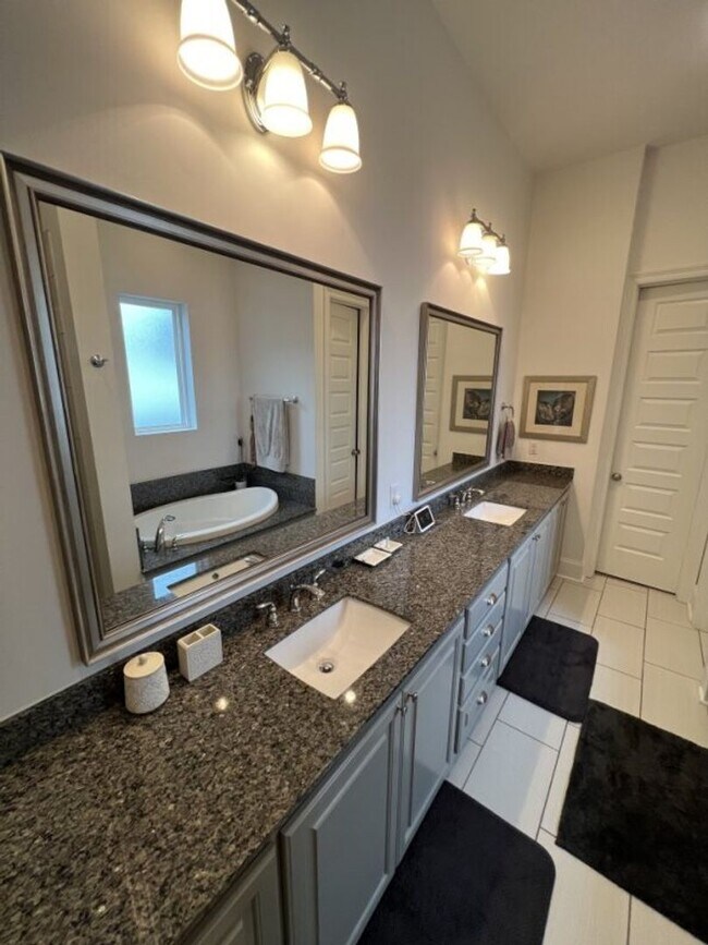 Building Photo - Luxury 4BR Home in Americana | 11 Ft Ceilings, Courtyard Living & Furnished Option