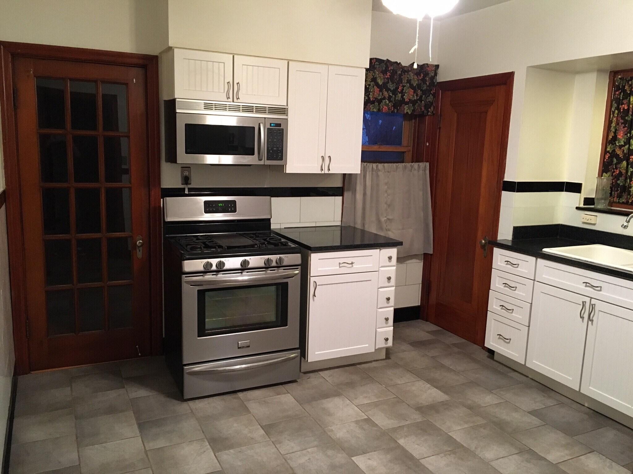 Updated kitchen with dishwasher, stainless steel appliances, and granite countertops. - 6000 Carlsbad Avenue