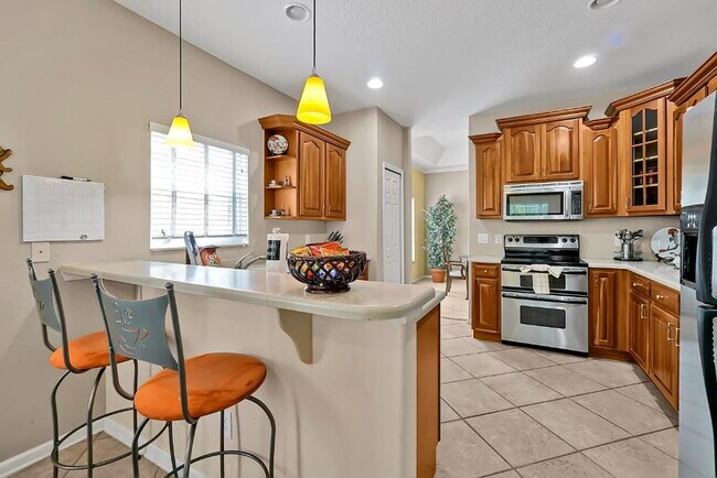 Building Photo - "Stunning 3BR Orlando Home with Private Screened Pool, Spa & Spacious Living Areas"