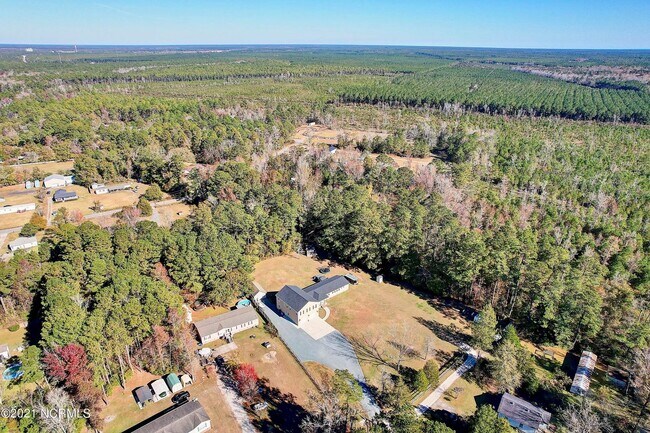 Building Photo - Land with plenty of personality