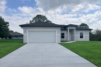 Building Photo - New 4 Bed / 2 Bath / 2 Car Garage Family Retreat in Desirable Lehigh Acres!