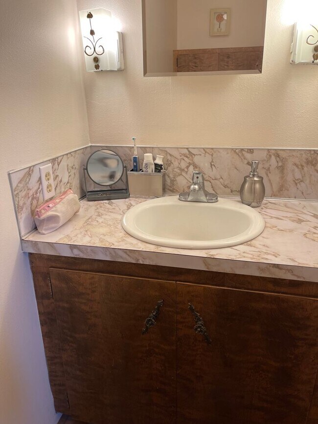 Building Photo - Spacious, four-bedroom, two-bathroom, coun...