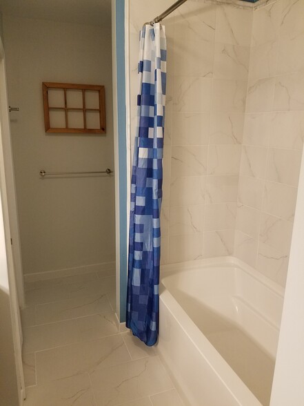 Clean updated bathroom with large vanity &amp; tiled shower! - 1901 Bodwell Rd