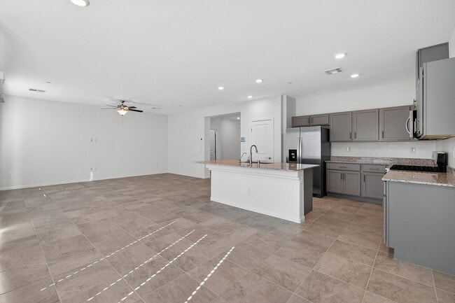 Building Photo - GENTLY USED 2024 HOME - 5 BEDROOMS WITH A FINISHED BACKYARD