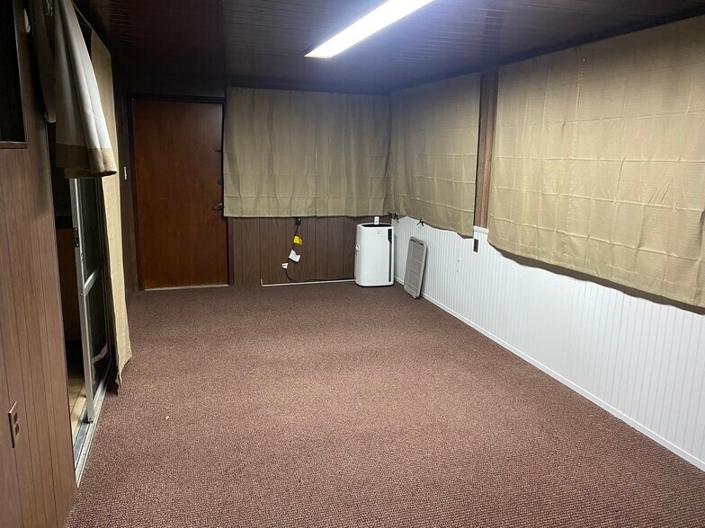 Porch-bedroom with curtains closed and exterior door #2 - 1816 Co Rd 432