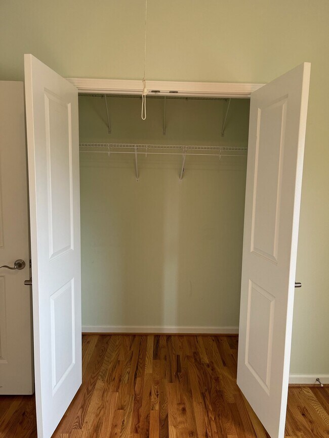 Building Photo - "Charming 2-Bed, 2-Bath Condo with Gleamin...