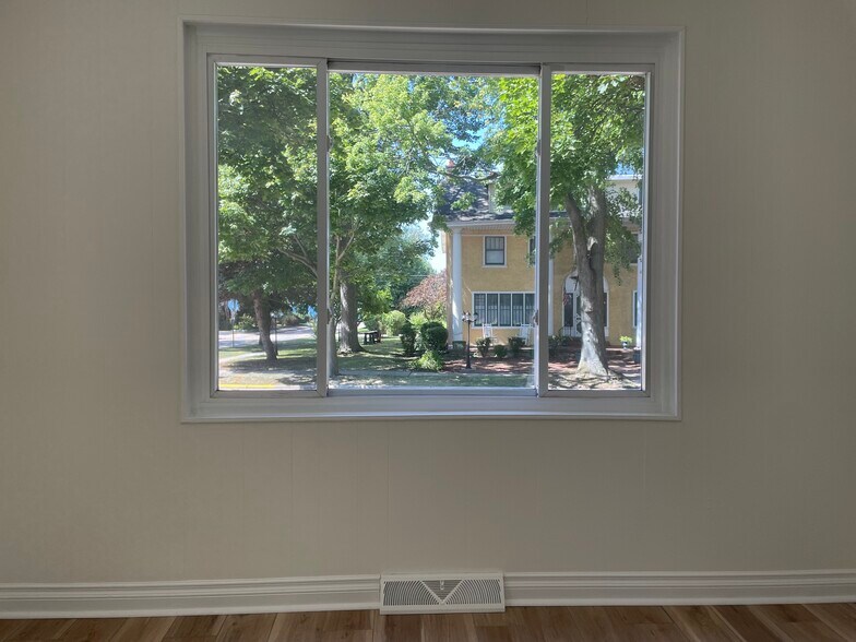 Large window in the living room with views of the lake - 1219 State St