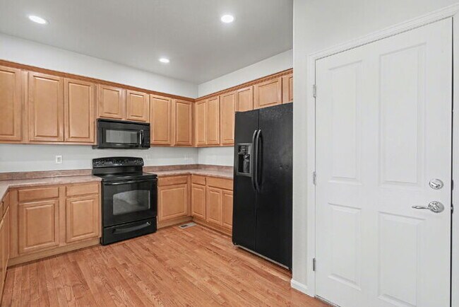 Building Photo - Beautifully Updated 3-Bedroom End-Unit Townhome Facing Open Space with Attached 2-Car Garage in G...