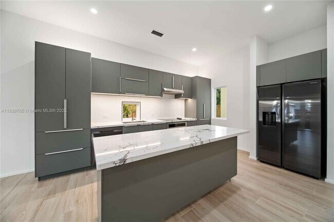 Building Photo - Northwest 9th Court, Miami, FL 33127 - 5 BR 3 BA townhouse